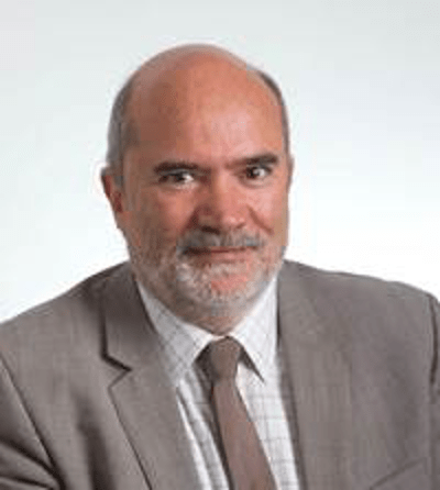 A man is smiling at the camera