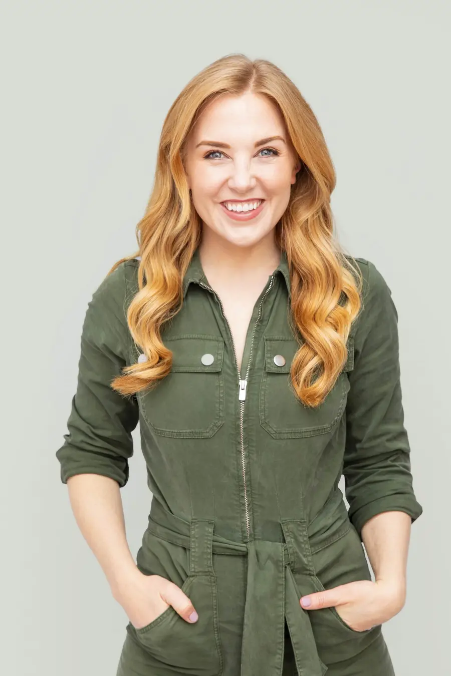 A woman is smiling towards the camera