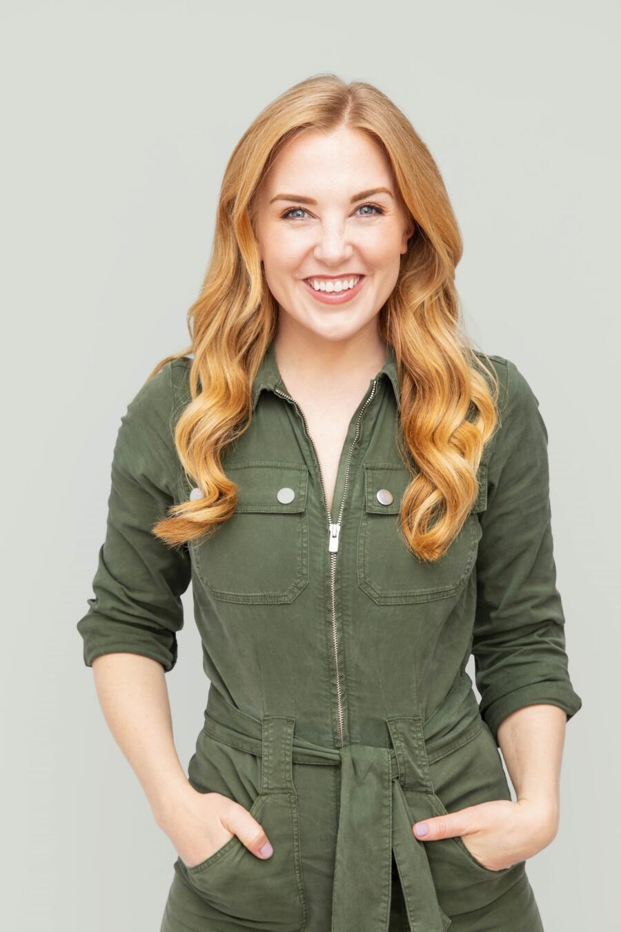 A woman is smiling towards the camera