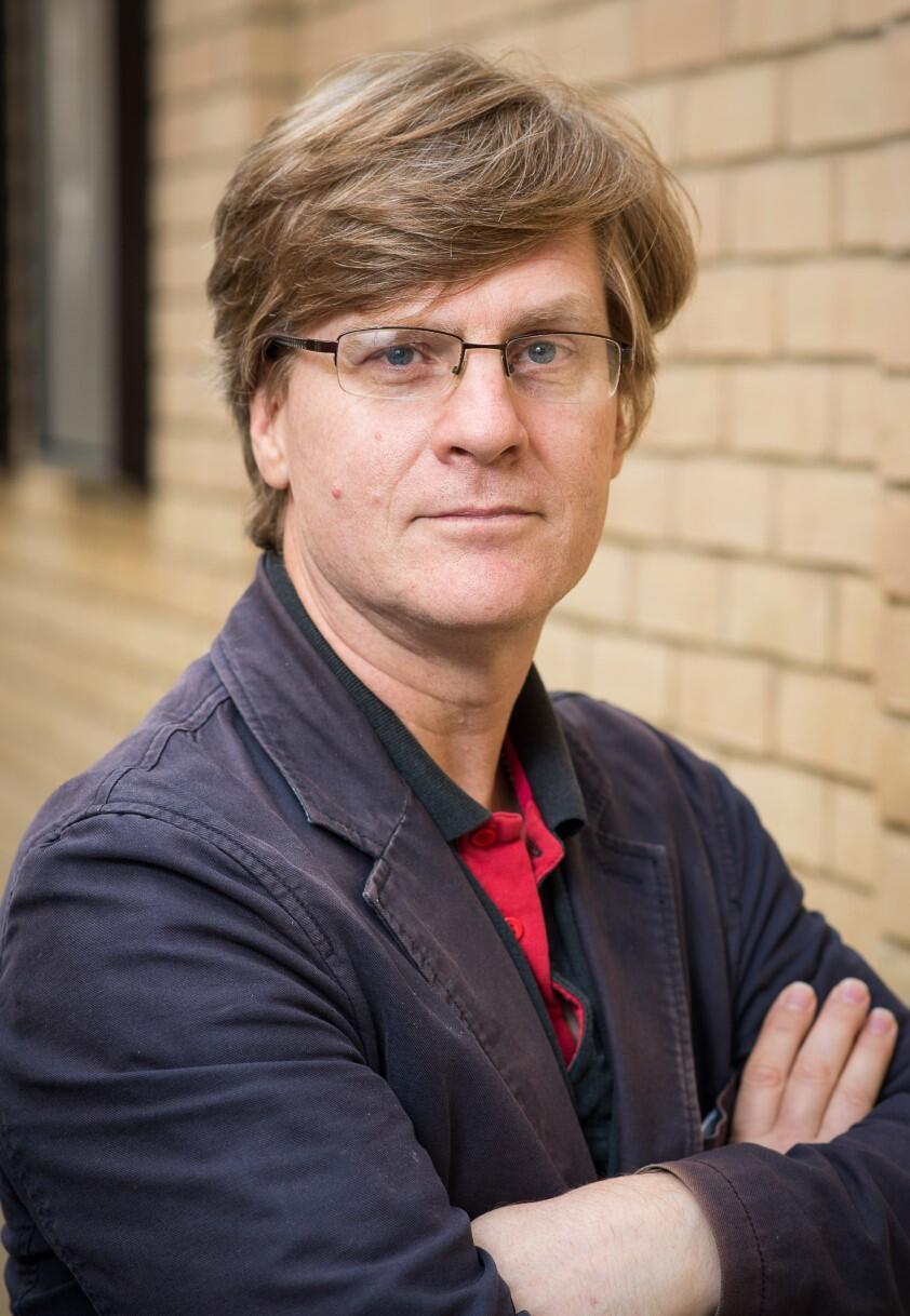 A man is looking at the camera