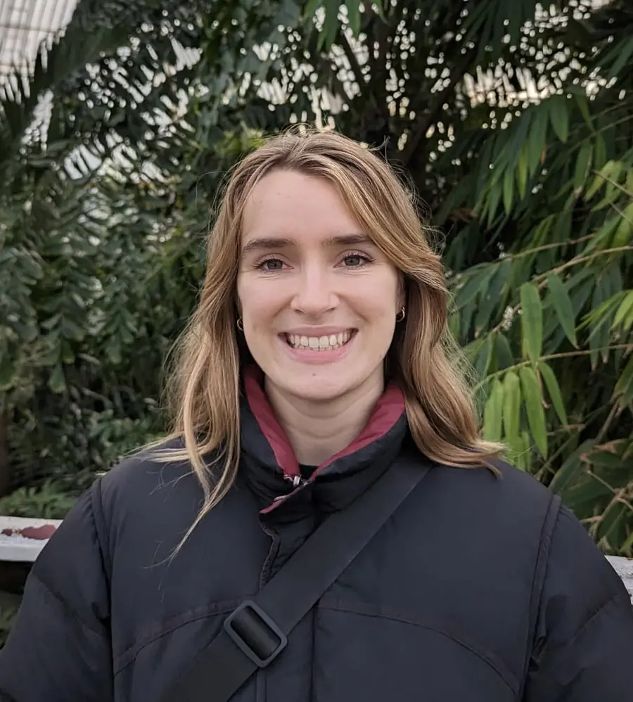a person is smiling towards the camera