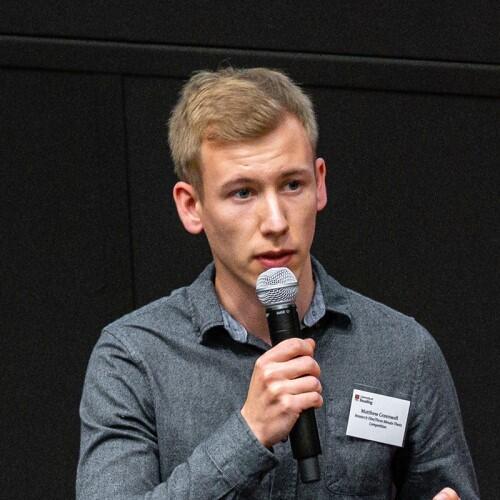 a man is speaking into a microphone