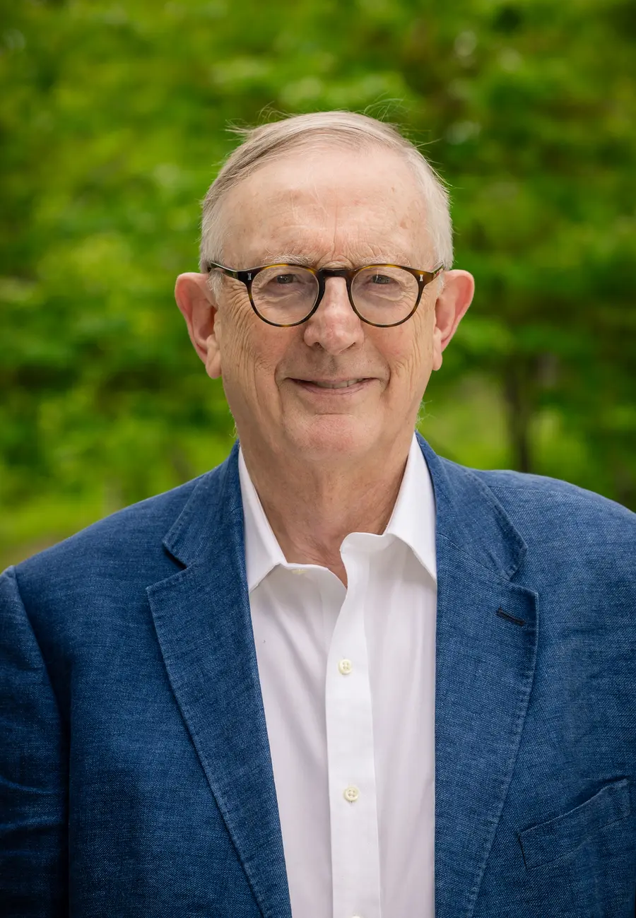 Image of Graham Farmelo wearing a shirt, jacket and glasses