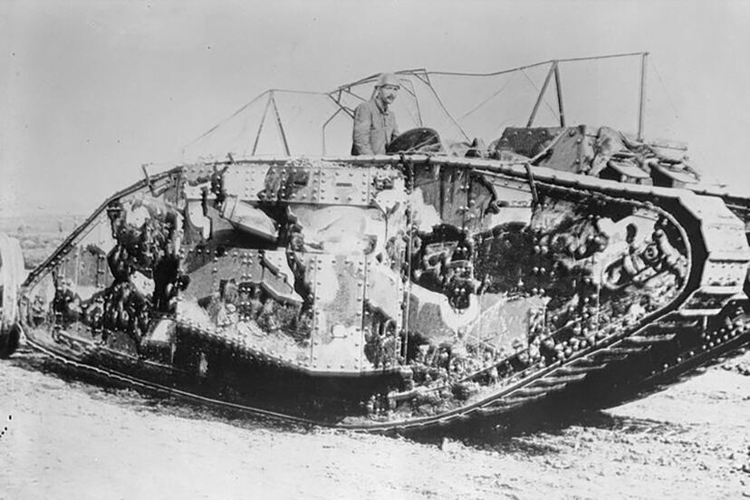 A British Mark I tank draped with the Solomon camouflage scheme