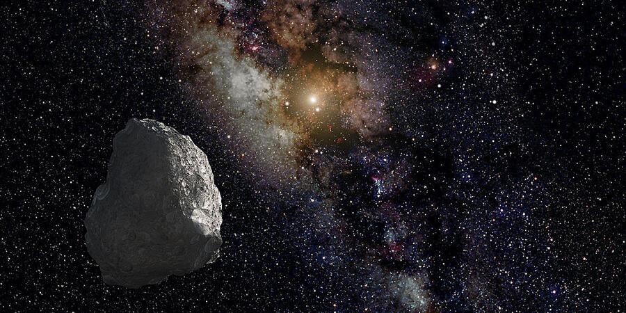 Artist impression of the Kuiper belt, showing an asteroid close to the point of view