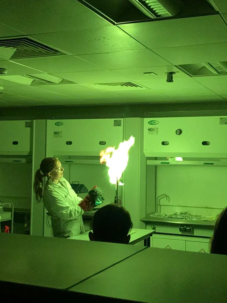Jess showing the different colours flames turn based on the elements