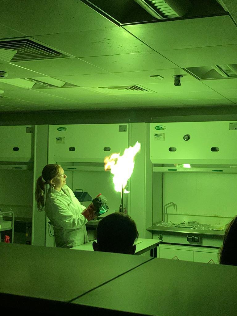 Jess showing the different colours flames turn based on the elements
