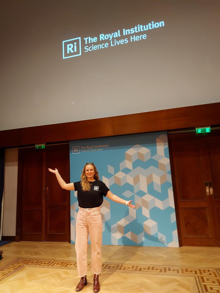 Jess presenting to 120 girls in the Michael Faraday theatre
