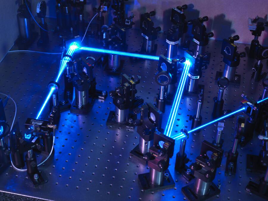 Laser light that probes a single ion of ytterbium in an optical atomic clock lattice optical clock