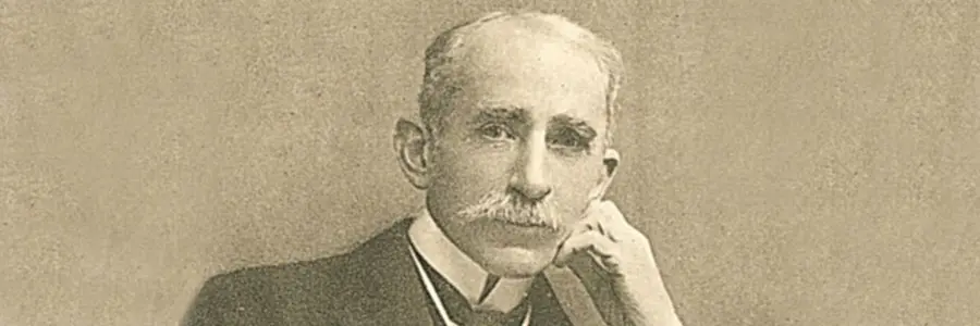 John Ambrose Fleming, with white hair and moustache, rests his head on his hand