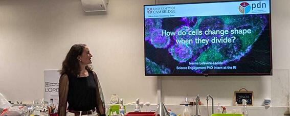 Jeanne in the Ri lab giving a lecture titled "how do cells change shape when they divide?"