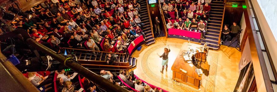 A crowded lecture in the Ri theatre