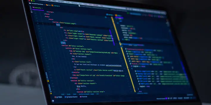A laptop with several lines of code on screen