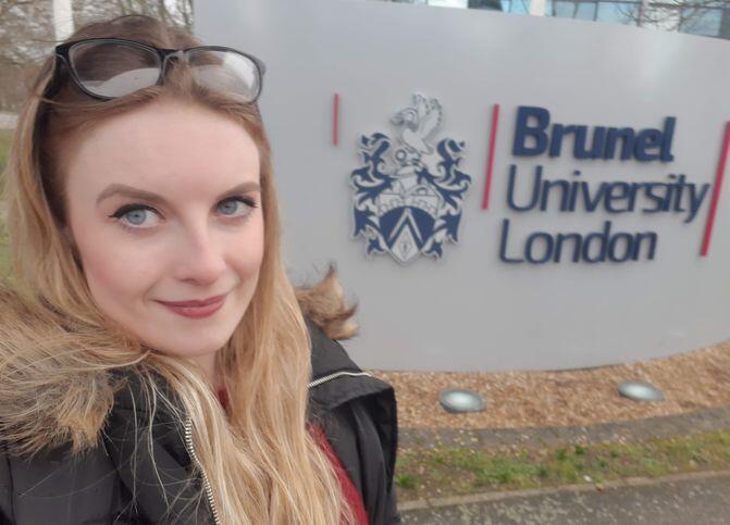 Kathryn outside of the front entrance to Brunel University London