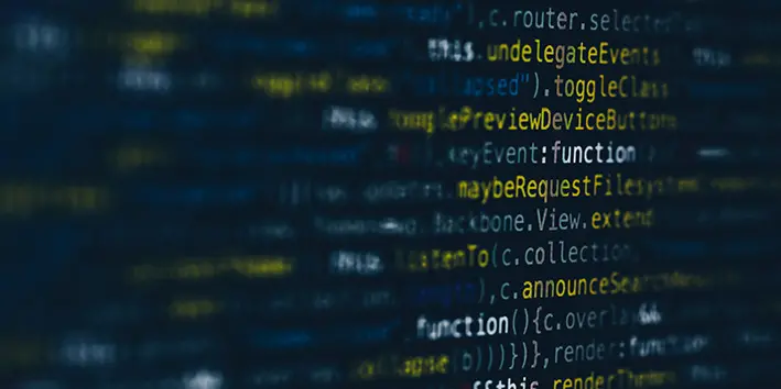 A moody close-up of code on a dark screen