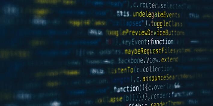 A moody close-up of code on a dark screen