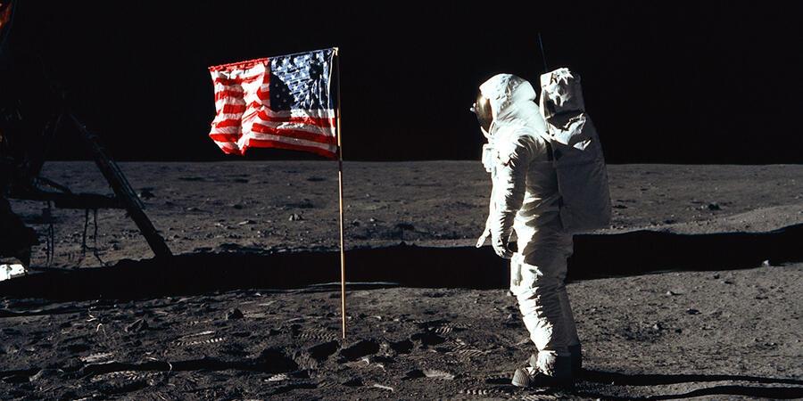 An image from the NASA Moon landing, showing an astronaut and the US flag