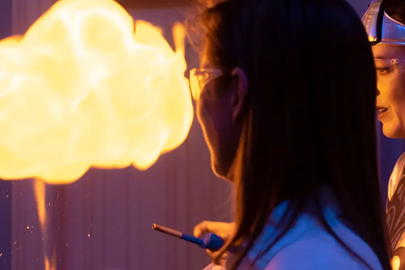 Two women watching an explosion