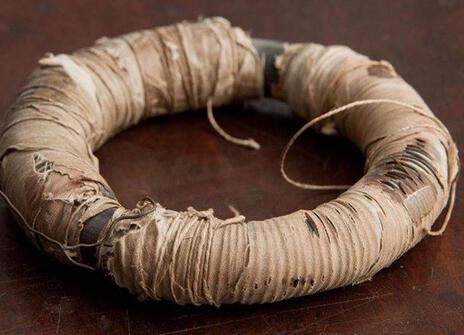 iron ring covered in copper wires and cotton cloth