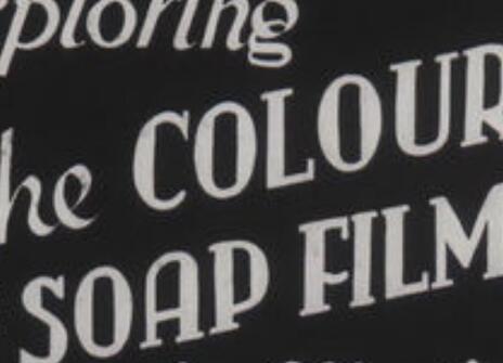 still from the soap film series, with printed text saying 'THE COLOURS OF SOAP FILMS' written in cursive