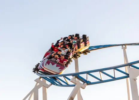 People riding a roller coaster 