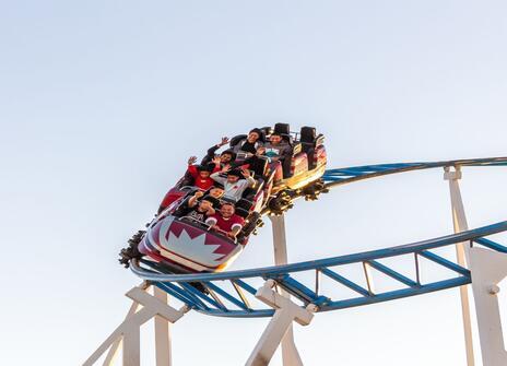 People riding a roller coaster 