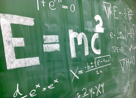 Maths equations on a chalkboard