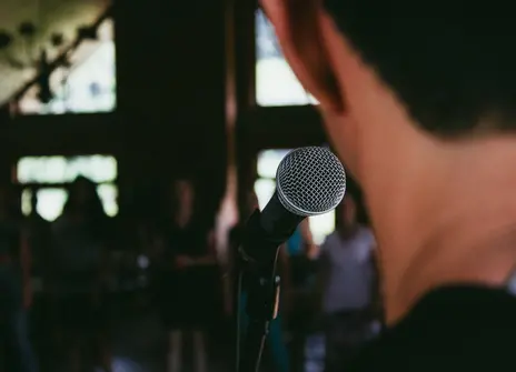 man speaking into microphone