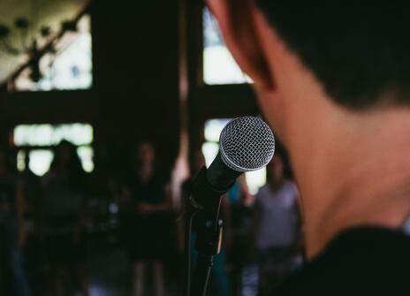 man speaking into microphone