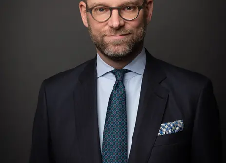 A picture of Vincent Nobel, he is a white man wearing glasses and a navy suit