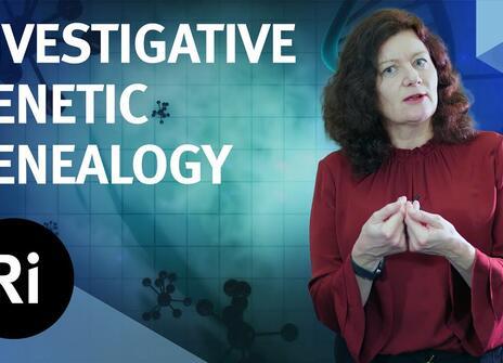 The speaker faces the camera, hands slightly clasped together. Overlayed are the words 'INVESTIGATIVE GENETIC GENEALOGY' alongside the Royal Institution's logo.