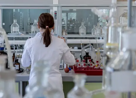 A person stood at a laboratory desk