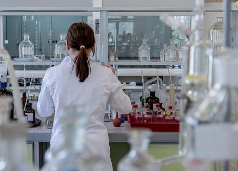 A person stood at a laboratory desk