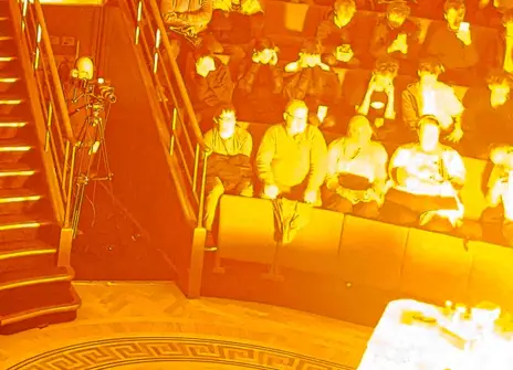 The Ri Theatre with a fire demonstration surrounded by the audience