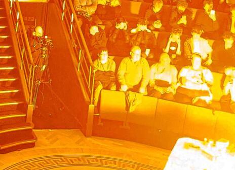 The Ri Theatre with a fire demonstration surrounded by the audience