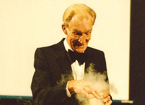 Bill Coates performing a science demo with smoke