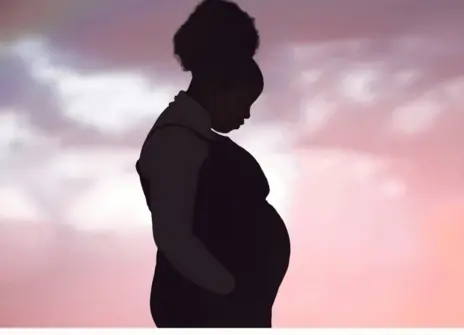 Silhouette of a pregnant woman.