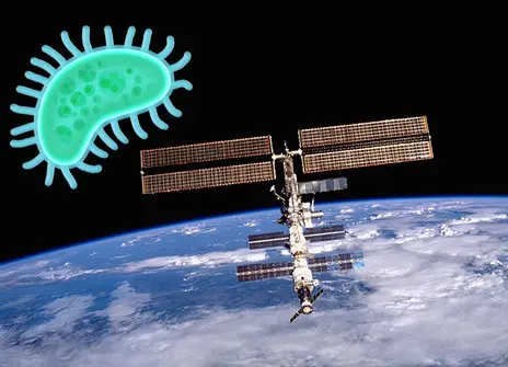 A microbe emoji looming over the ISS
