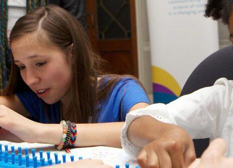 Volunteer and young participant getting stuck in at an Ri Family Fun Day