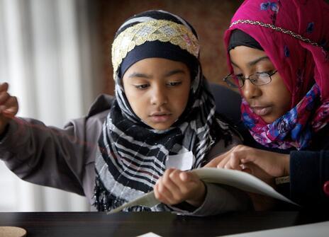 Children looking at a piece of paper