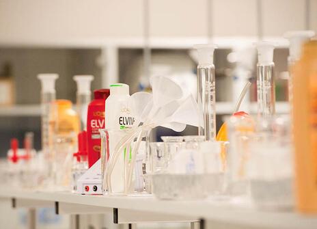 shampoo bottles and scientific beakers and tubes