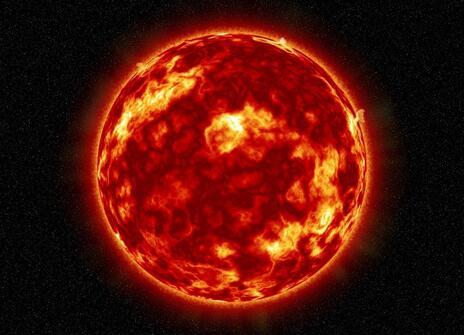 A red fiery sun lies in the middle of a black background. 
