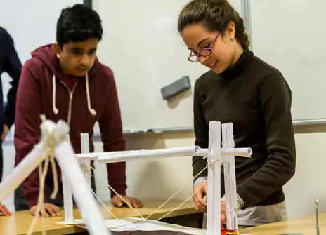 Two participants building a structure
