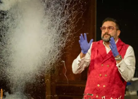 Presenter with a plume of smoke in front of them