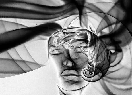 A person face is created using lots of smoke and lines. 