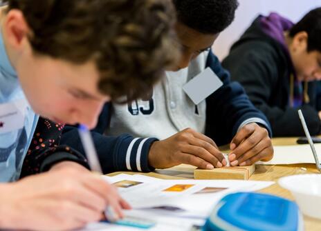 Students drawing and learning about hexagons 