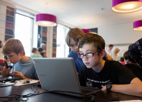 Children code on a laptop