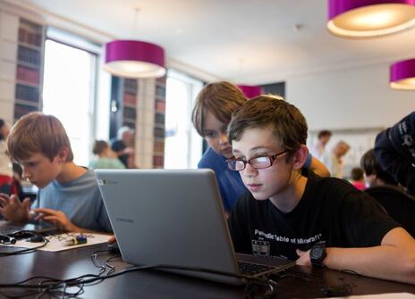 Children code on a laptop