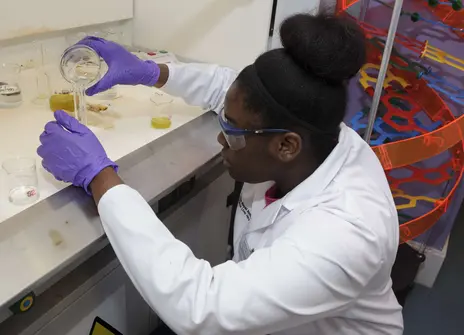 A participant measuring out a chemical in the UYSC