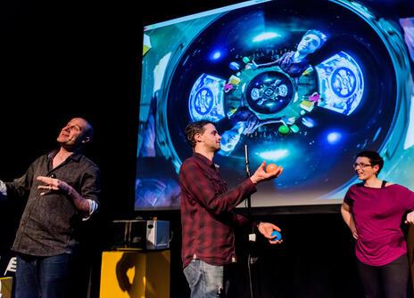 Matt Parker, Steve Mould and Helen Arney performing on stage